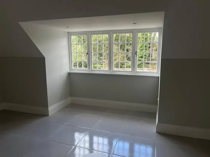 Empty room with a freshly mopped tiled floor