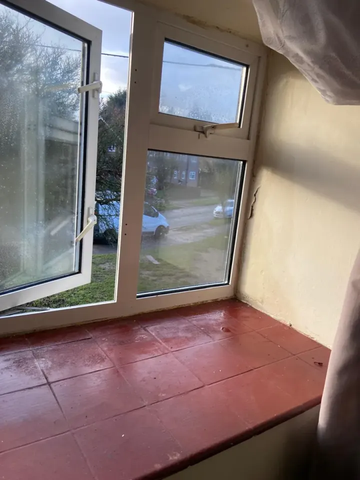 The same window frame and sill clean after mould treatment